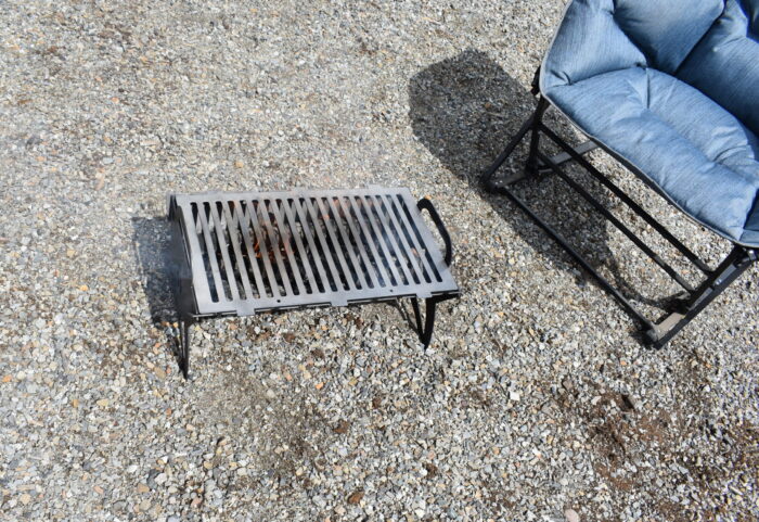 Portable Grill for outdoor bar-b-ques on the go. wood or briquette fired.